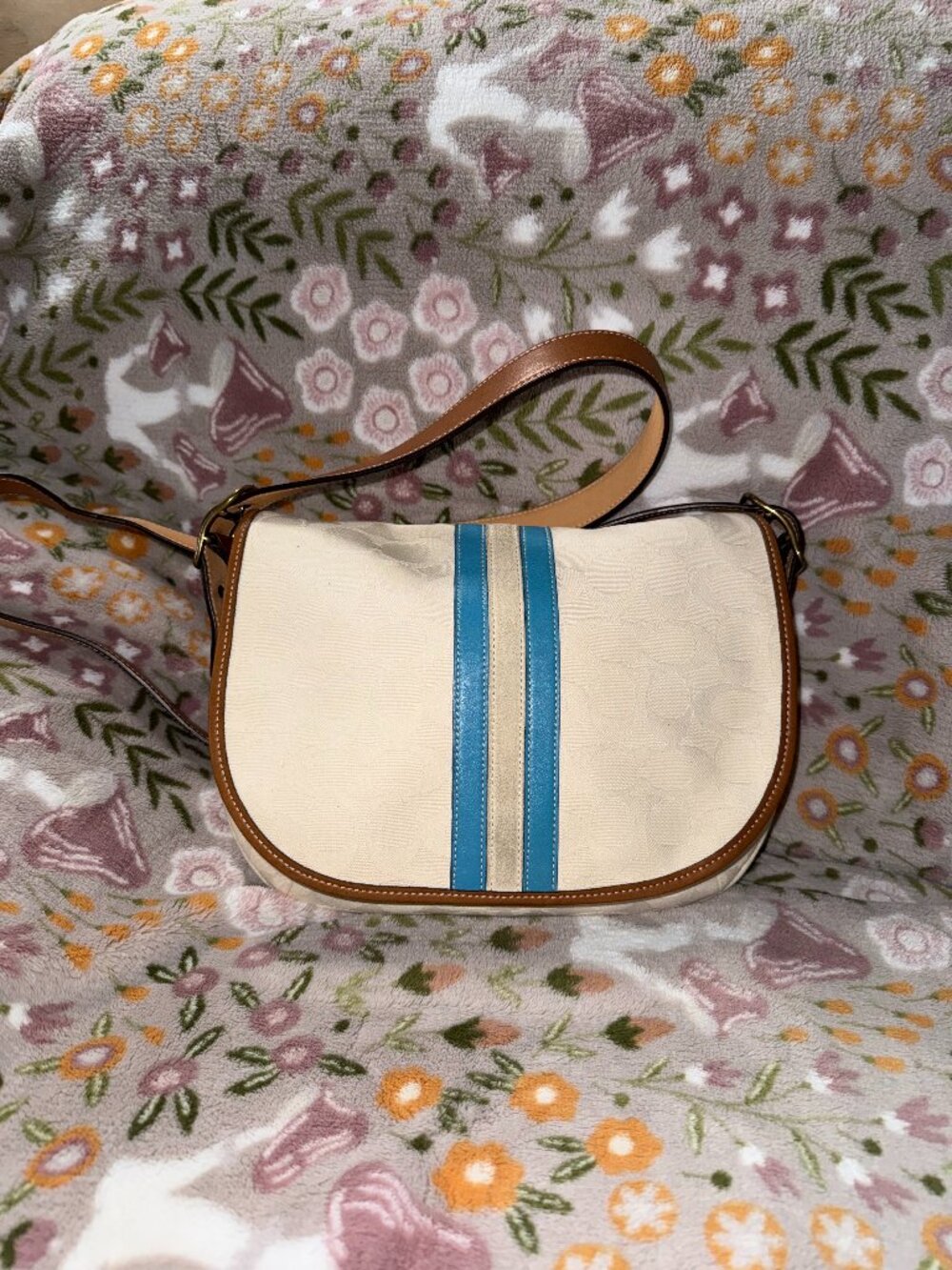 Coach signature stripe saddle flap bag